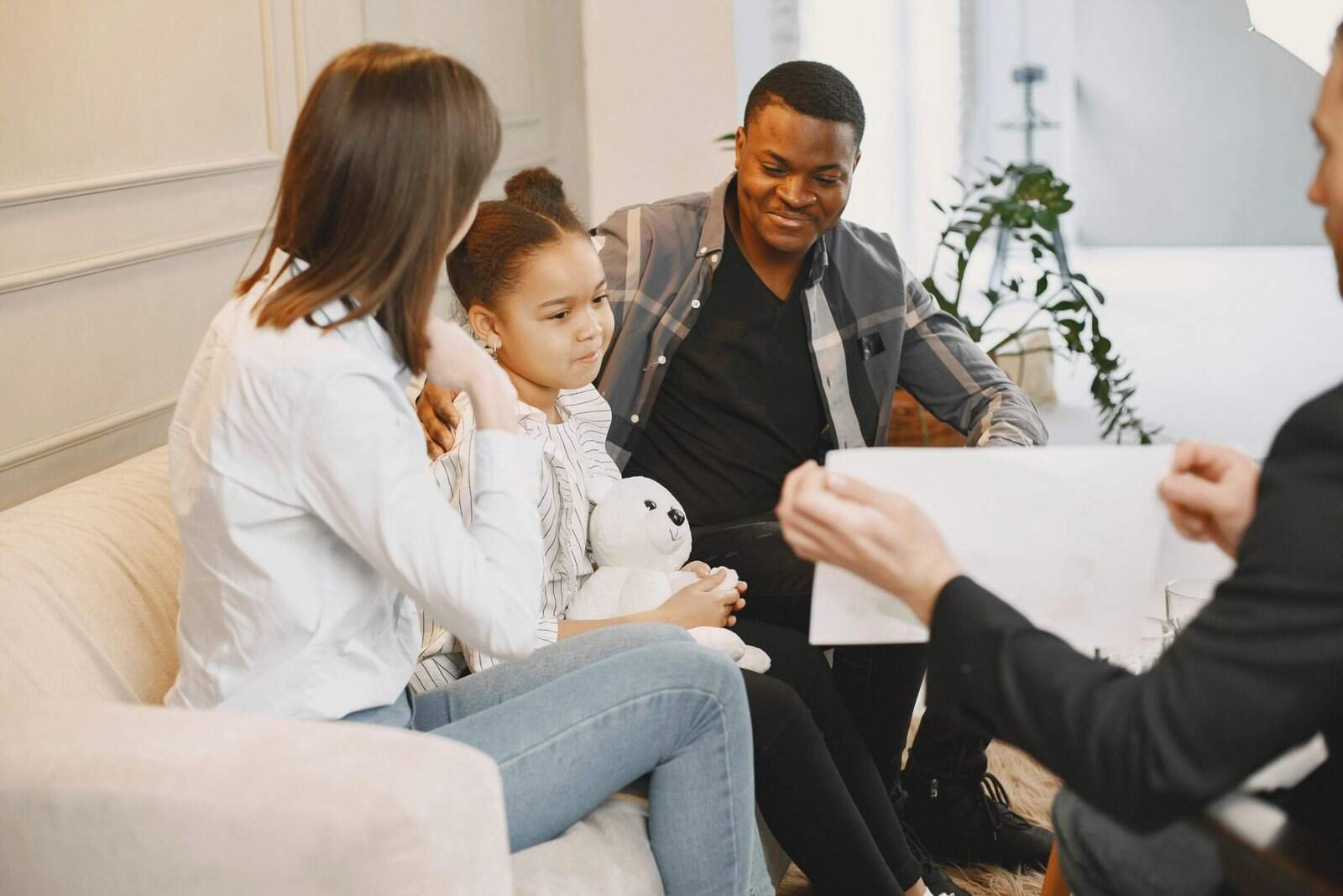 Family with a child in a therapy session